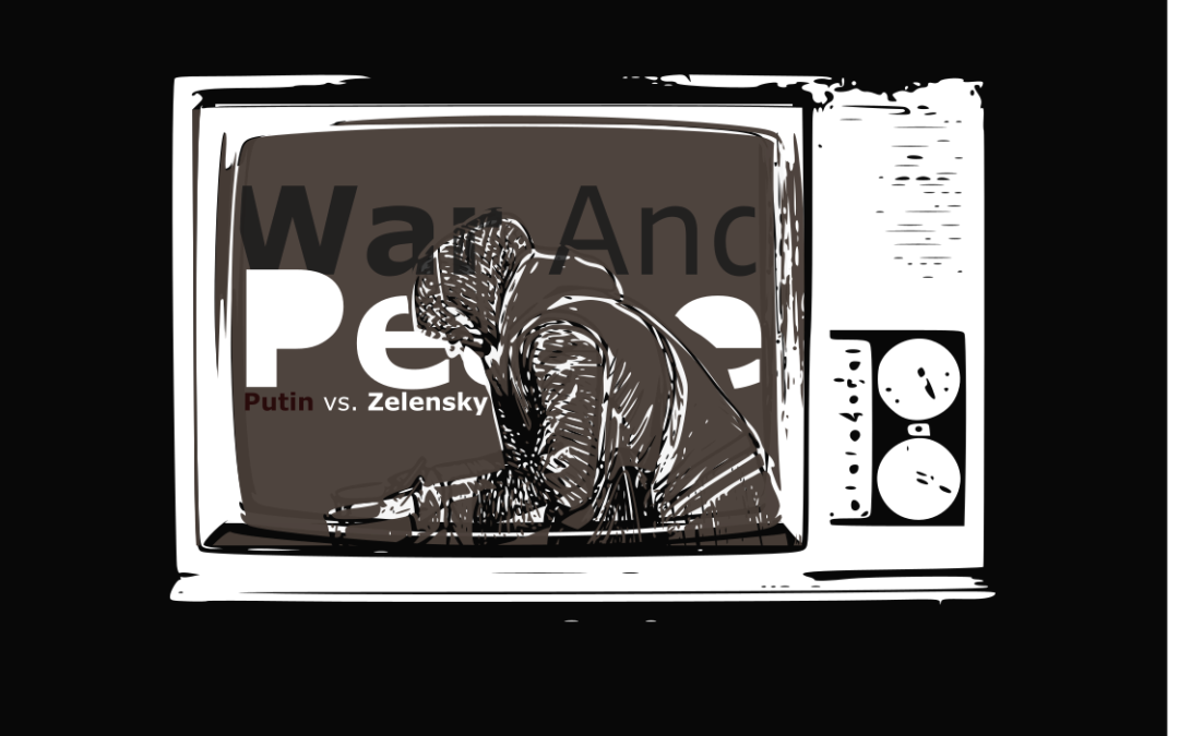 a man in a hoodie looking at a screen